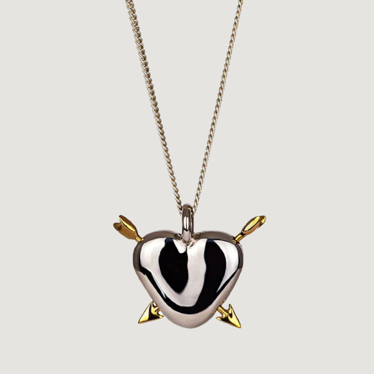 HEART-SHAPED SILVER PENDANT WITH GOLD PLATING
