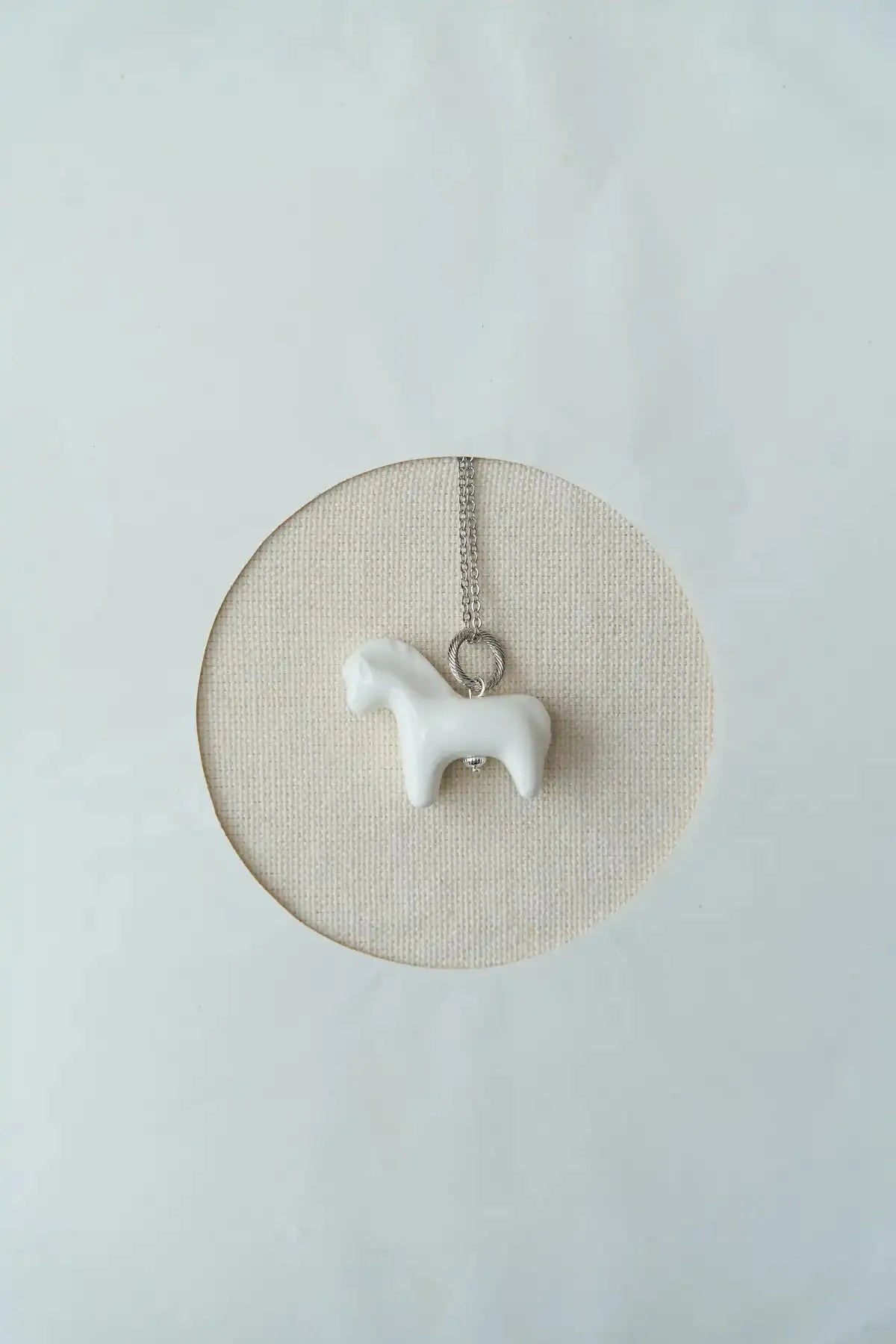 LIULI PENDANT WITH A HORSE ON A GOLD CHAIN